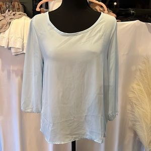 Baby blue long sleeve blouse with button back detail